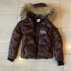 SAM puffer jacket with fur trim hood.